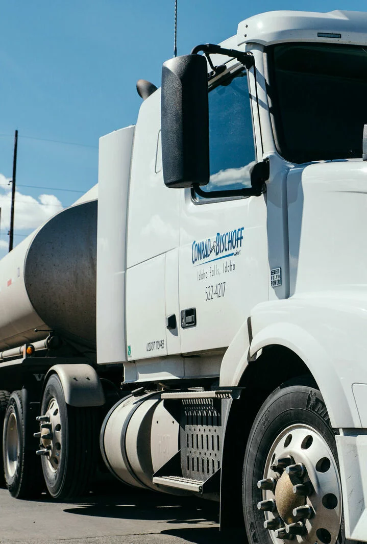 White Conrad and Bischoff fuel tanker on the road transporting premium fuel and lubricant products.